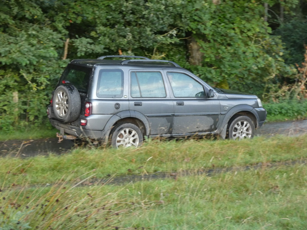 charlie smiles at me as he drives away in his grey freelander along woodburn lane